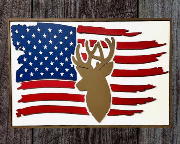 3D laser cut wood American flag deer sign with a torn United States flag background and a detailed deer head in the center.