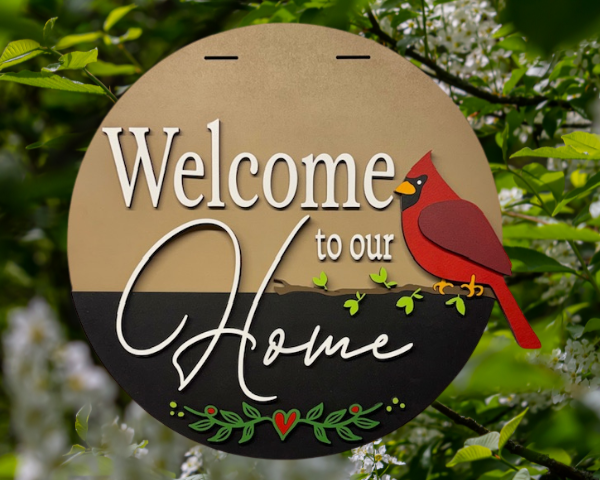 3D laser cut cardinal welcome sign featuring a red cardinal sitting on a small branch with the words "Welcome to Our Home"