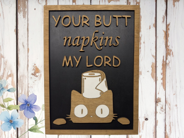 Funny bathroom sign with cat face and toilet paper roll